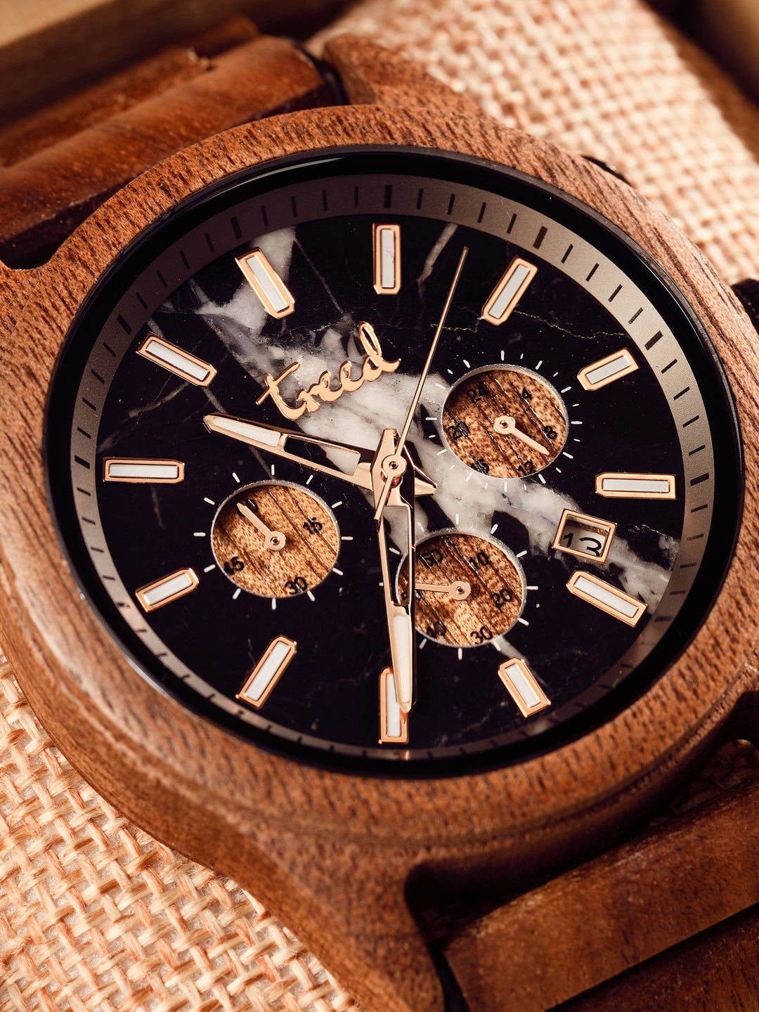 Close-up of genuine black marble dial on Treed Canopy walnut chronograph watch