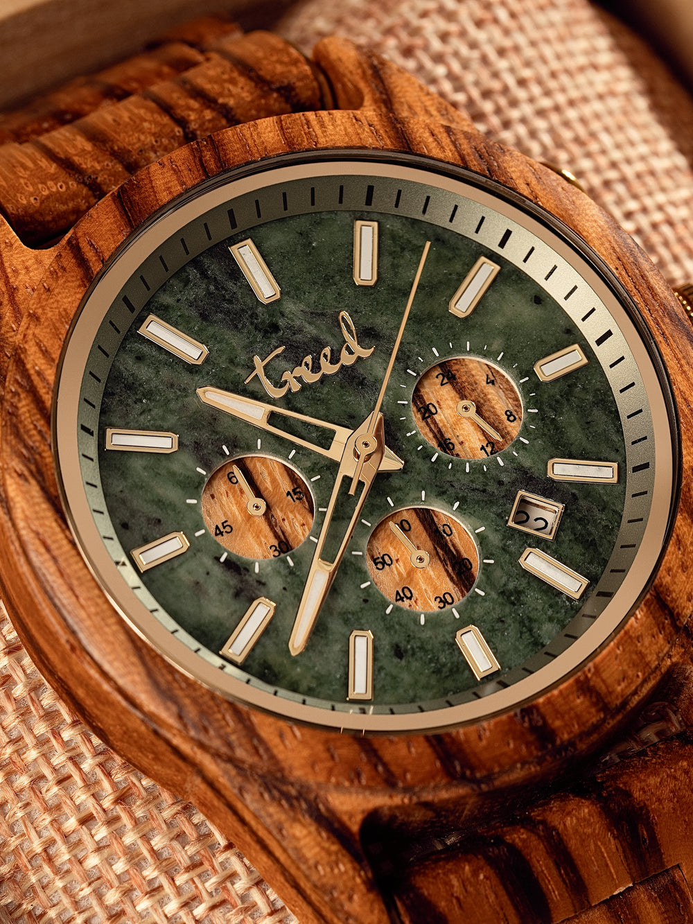 Close-up of genuine green marble dial on Treed Canopy Zebrawood watch