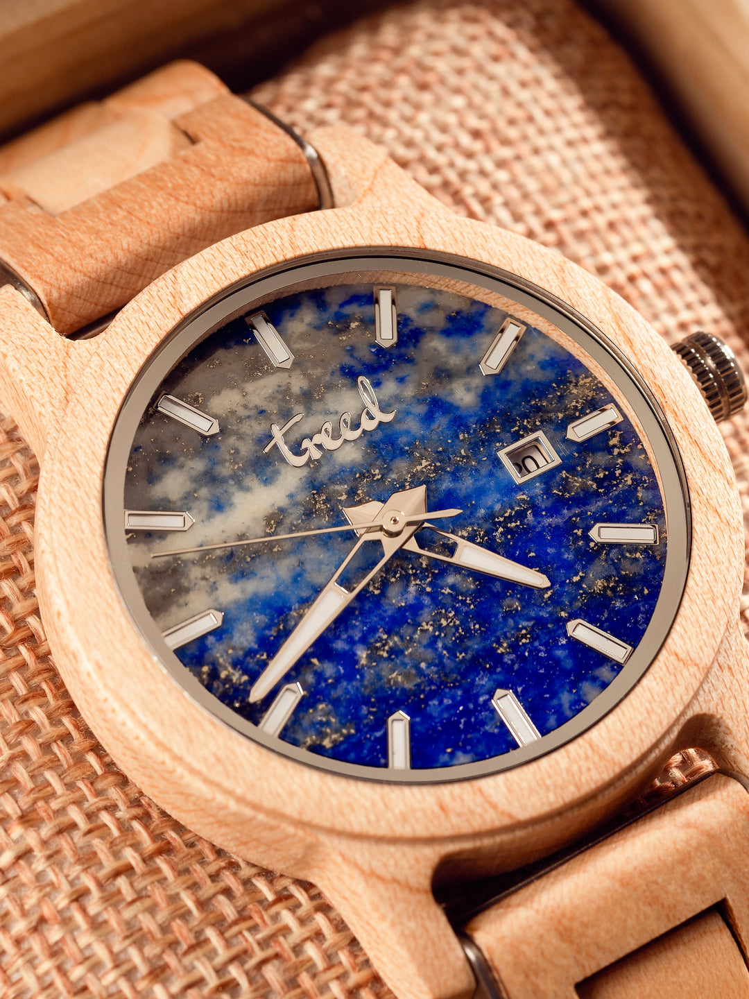 Close-up of lapis lazuli dial on Treed Alpine Maple wooden watch
