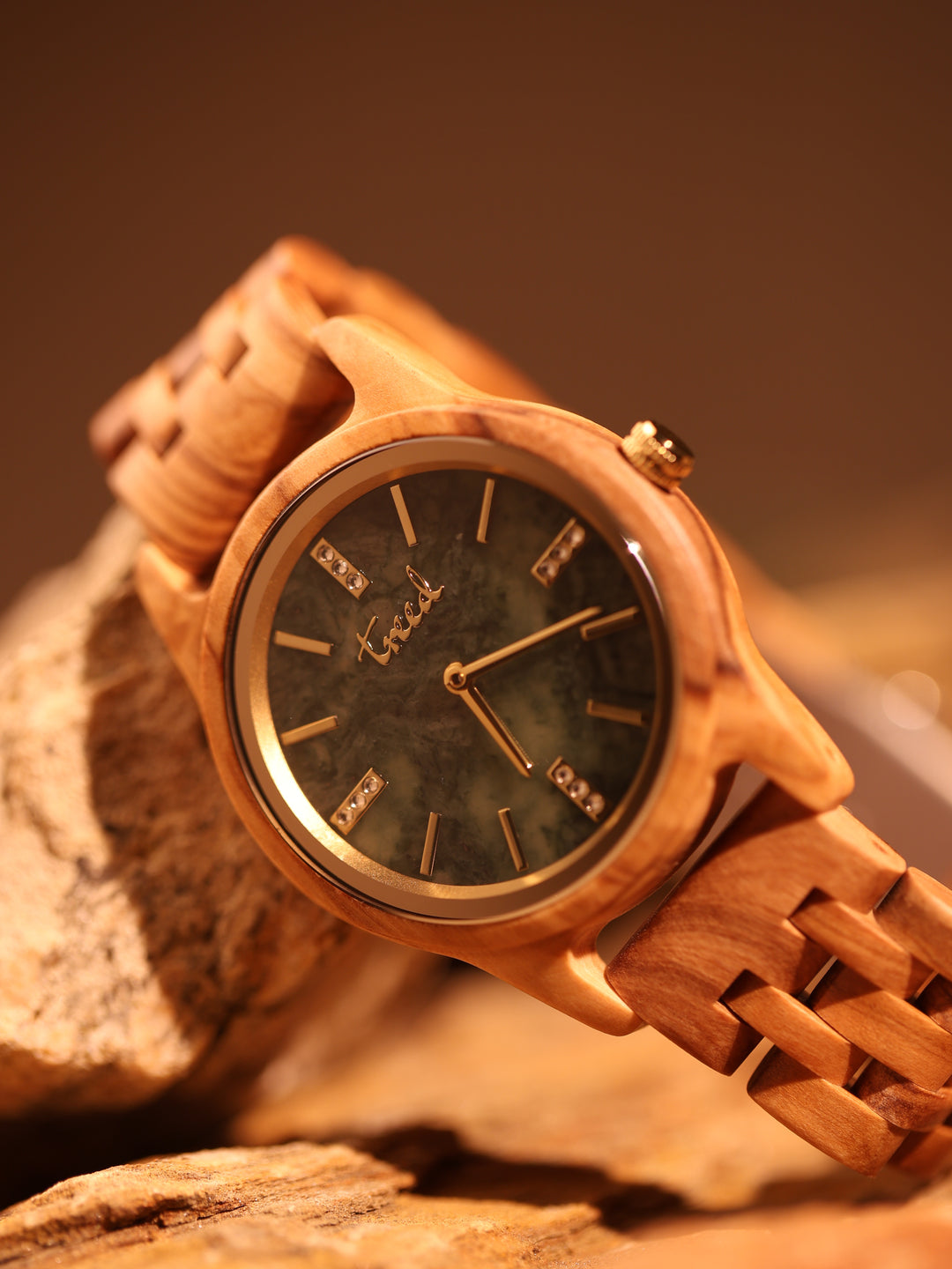 Side view of Treed Lana olive wood case and crown