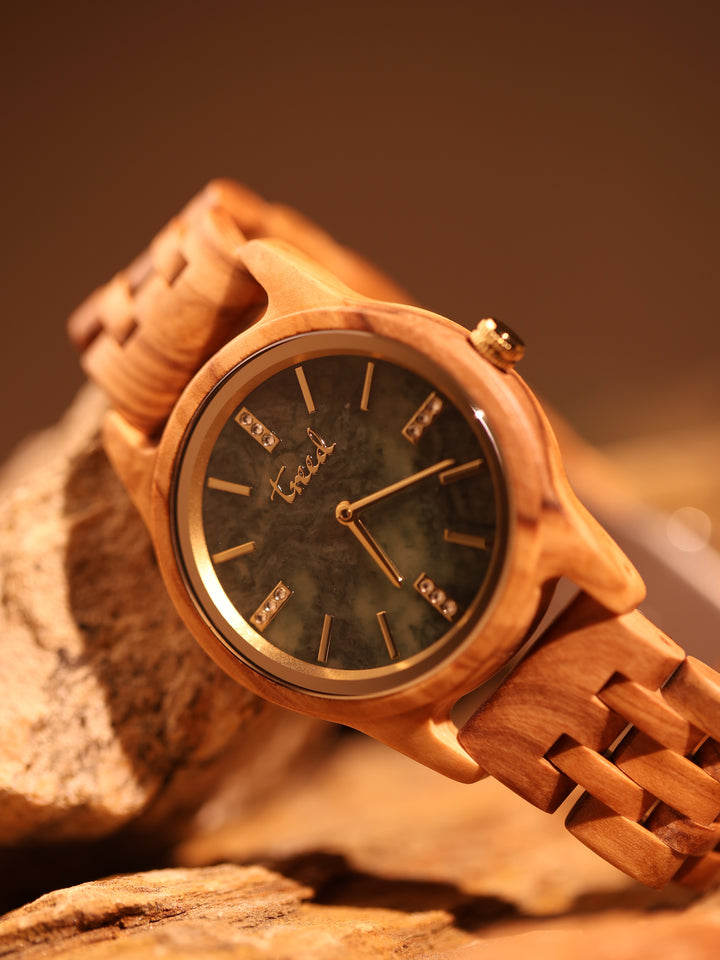 Side view of Treed Lana olive wood case and crown