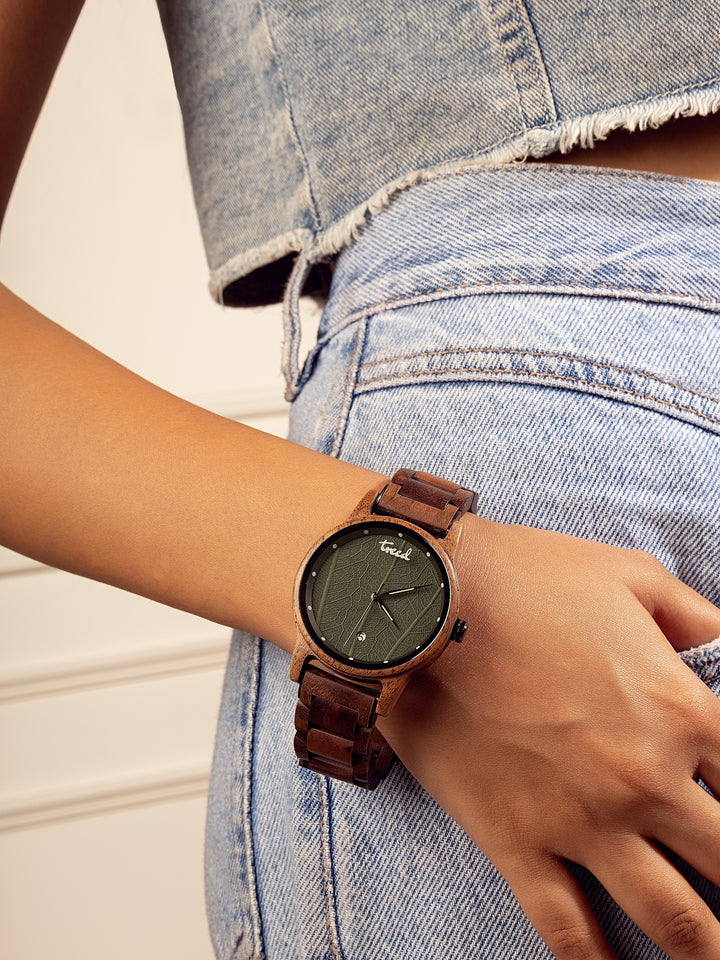 Treed GROOVE Walnut watch worn on wrist showing green leaf dial